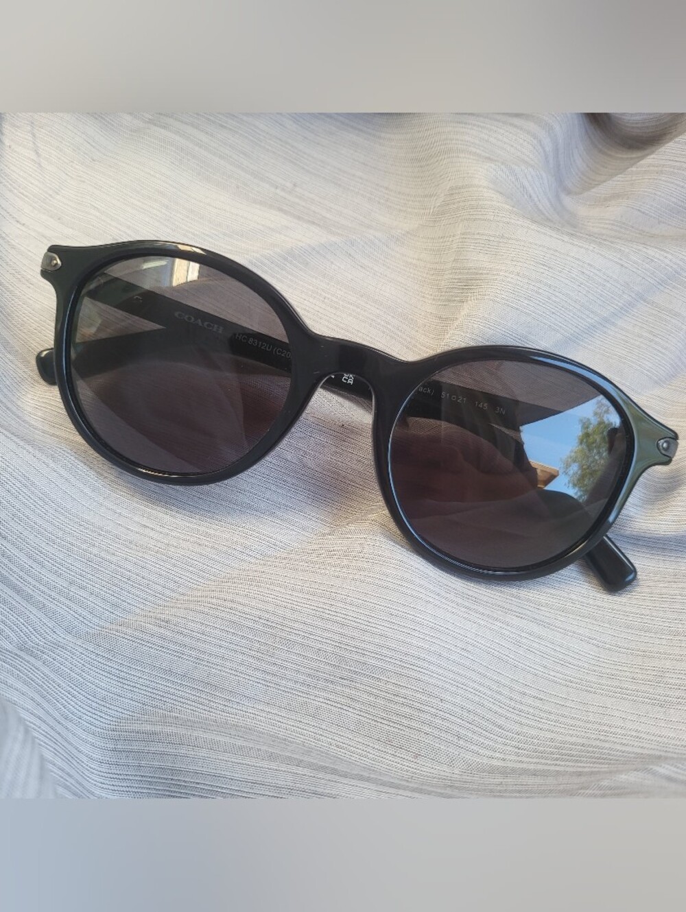 Coach Glossy Black Round Frame Sunglasses with Smoke Lenses